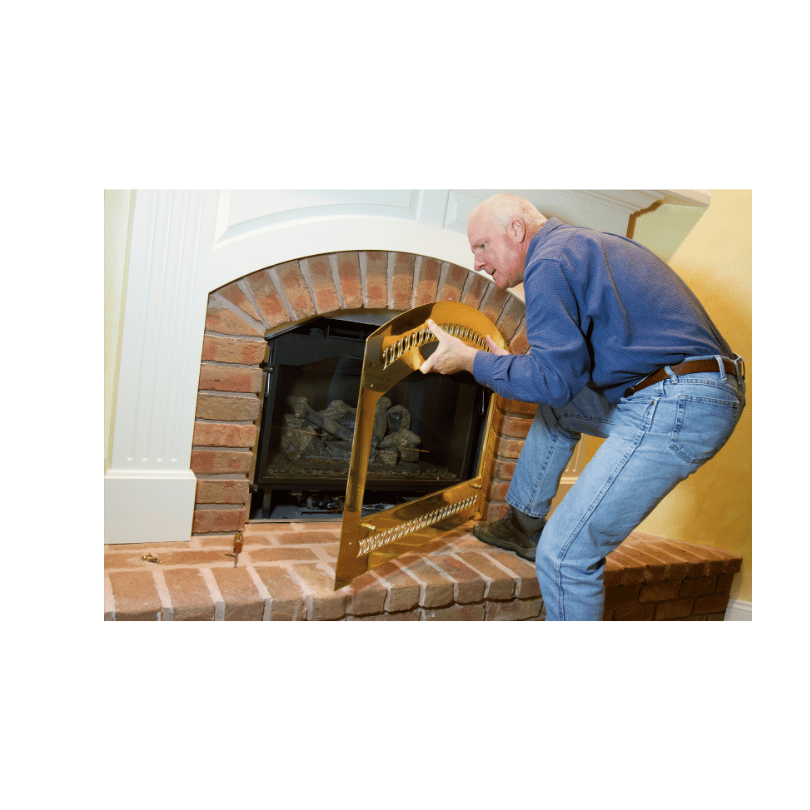 man-repairing-fireplace-in-house